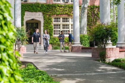 students standing next to the columns on the Pacific campus