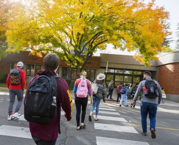 students walk to class on the Sacramento campus